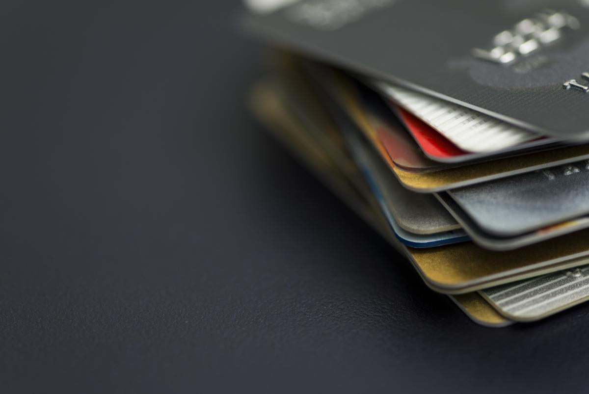grey background with stack of credit cards