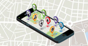 Mobile Phone and Map; Pins labeling businesses