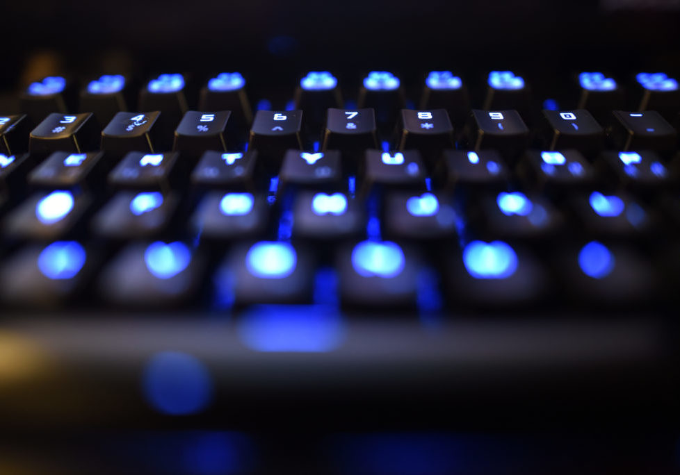 computer keyboard in shadow